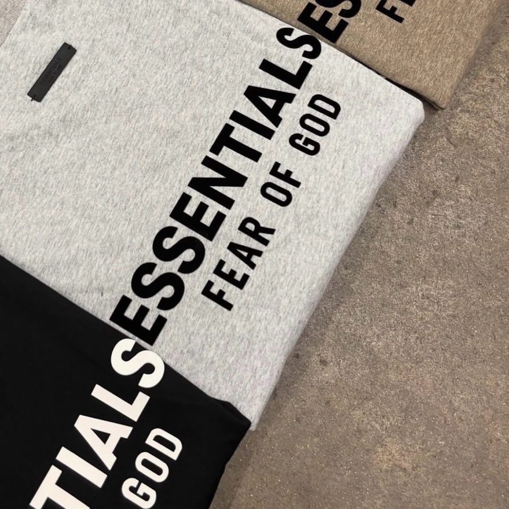Fear of God Essentials Crewneck in Gray, Black, and Tan